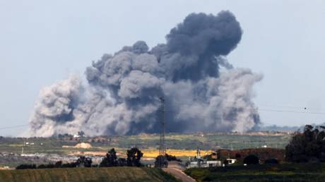 smoke billowing over the Gaza Strip during Israeli bombardment.