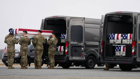 FILE PHOTO: An Army team moves the remains of US troops killed in the US-Israeli military operation against Iran, March 7, 2026.