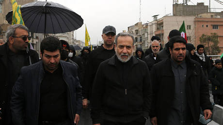 Iranian Foreign Minister Abbas Araghchi (C) participates in the traditional Quds Day rally in the capital Tehran on March 13, 2026.