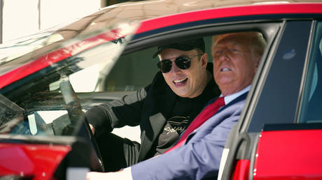 Donald Trump and Elon Musk sit in a Model S on the South Lawn of the White House.