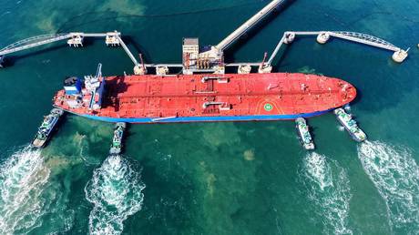 A cargo ship loaded with imported crude oil docks at a terminal berth in Qingdao, Shandong Province, China