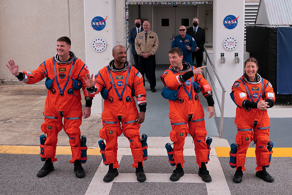 (L-R) Mission specialist Jeremy Hansen of CSA (Canadian Space Agency), pilot Victor Glover, commander Reid Wiseman and mission specialist Christina Koch walk out of the Neil A. Armstrong Operations and Checkout Building ahead of the launch of Artemis