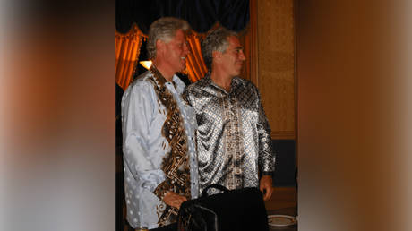 FILE PHOTO. Bill Clinton and Jeffrey Epstein are seen outside No 10 Downing Street in one of the images released by the US Department of State.
