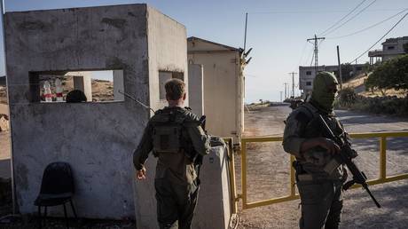 Israeli soldiers at a checkpoint between the towns of Hader and Majdal Shams in Syria, June 11, 2025.