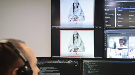 An Albanian expert works at the National Agency for Information Society as an artificial intelligence 'minister' Diella, whose name means 'Sun' in Albanian, is seen on the screens in Tirana, Albania, September 12, 2025.