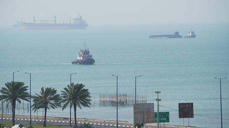 Boats navigate near Iran’s Qeshm Island in the Strait of Hormuz, April 28, 2026.