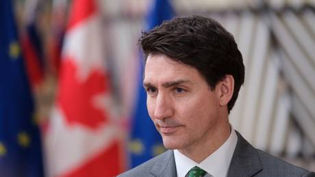 Prime Minister of Canada Justin Trudeau talks to reporters in Brussels on February 12, 2025.