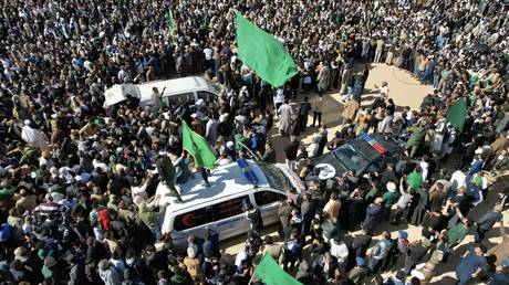 People attending the funeral of Saif al-Islam Gaddafi in Bani Walid, Libya.