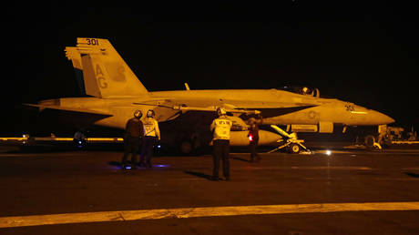 FILE PHOTO: A US F/A-18E Super Hornet preparing for launch from the flight deck of the USS Abraham Lincoln aircraft carrier.