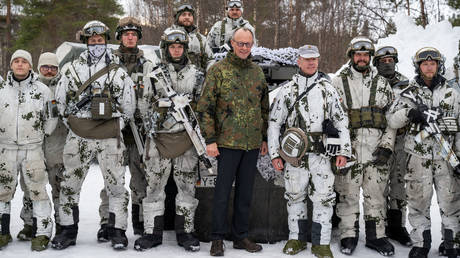 FILE PHOTO: German Chancellor Friedrich Merz visiting a military training area.