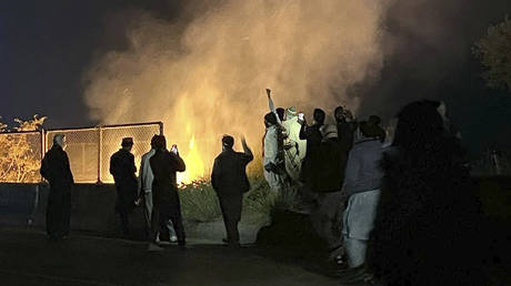 Supporters of imprisoned former premier Imran Khan's Pakistan Tehreek-e-Insaf party at a motorway in Attock district, Pakistan, November 24, 2024.