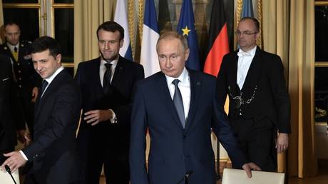 Russian President Vladimir Putin and Ukraine's Vladimir Zelensky arriving to a meeting with French President and German Chancellor on December 9, 2019 in Paris.