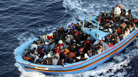 FILE PHOTO. Boat with illegal migrants seen off the coast of Lampedusa, Italy on June 21, 2005.