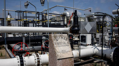 A stone commemorates the Druzhba crude oil pipeline at a refinery in Hungary.