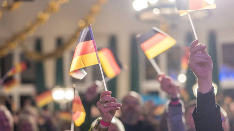 People take part in an AfD campaign event in Brandenburg, Germany, March 19, 2026.