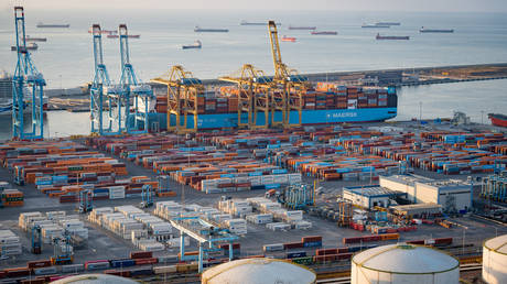 FILE PHOTO. Shipping containers and cargo ships at the Port of Barcelona, Spain.