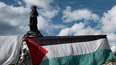 A Palestinian flag hangs in Place de la Republique as part of a protest asking for the ''recognition of the State of Palestine and the end of the genocide'' in Paris, France, on September 21, 2025.