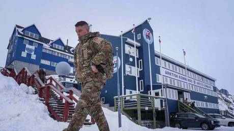 A Danish serviceman walks in front of the Joint Arctic Command center in Nuuk, Greenland, January 16, 2026