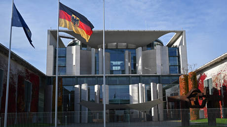 FILE PHOTO: The German flag flies in front of the Federal Chancellery, Berlin, Germany, October 31, 2025.