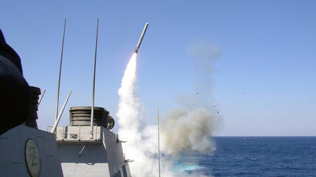 FILE PHOTO: A US warship launching a Tomahawk missile.