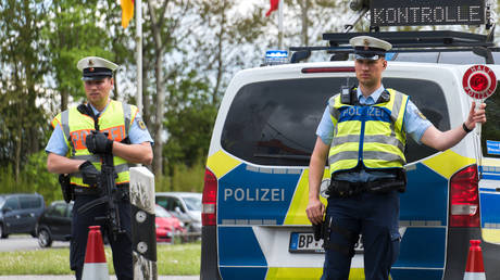 Police officers carry out checks at the German-Danish border.