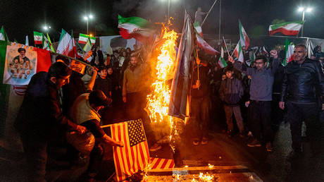 Iranians set fire to US and Israeli flags, Enghelab Square, Tehran, Iran, March 17, 2026.