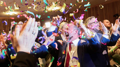 AfD members celebrate their result at the regional vote in the state of Rhineland-Palatinate.