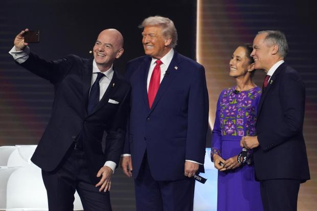 FIFA President Gianni Infantino takes a selfie with President Donald Trump, Mexican President Claudia Sheinbaum, and Canadian Prime Minister Mark Carney 