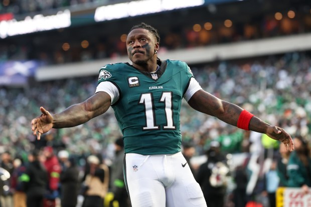 Philadelphia Eagles wide receiver A.J. Brown (11) gestures toward the crowd during pregame warm-ups before an NFL wild card playoff game against the San Francisco 49ers, Sunday, Jan. 11, 2026, in Philadelphia. (AP Photo/Terrance Williams)