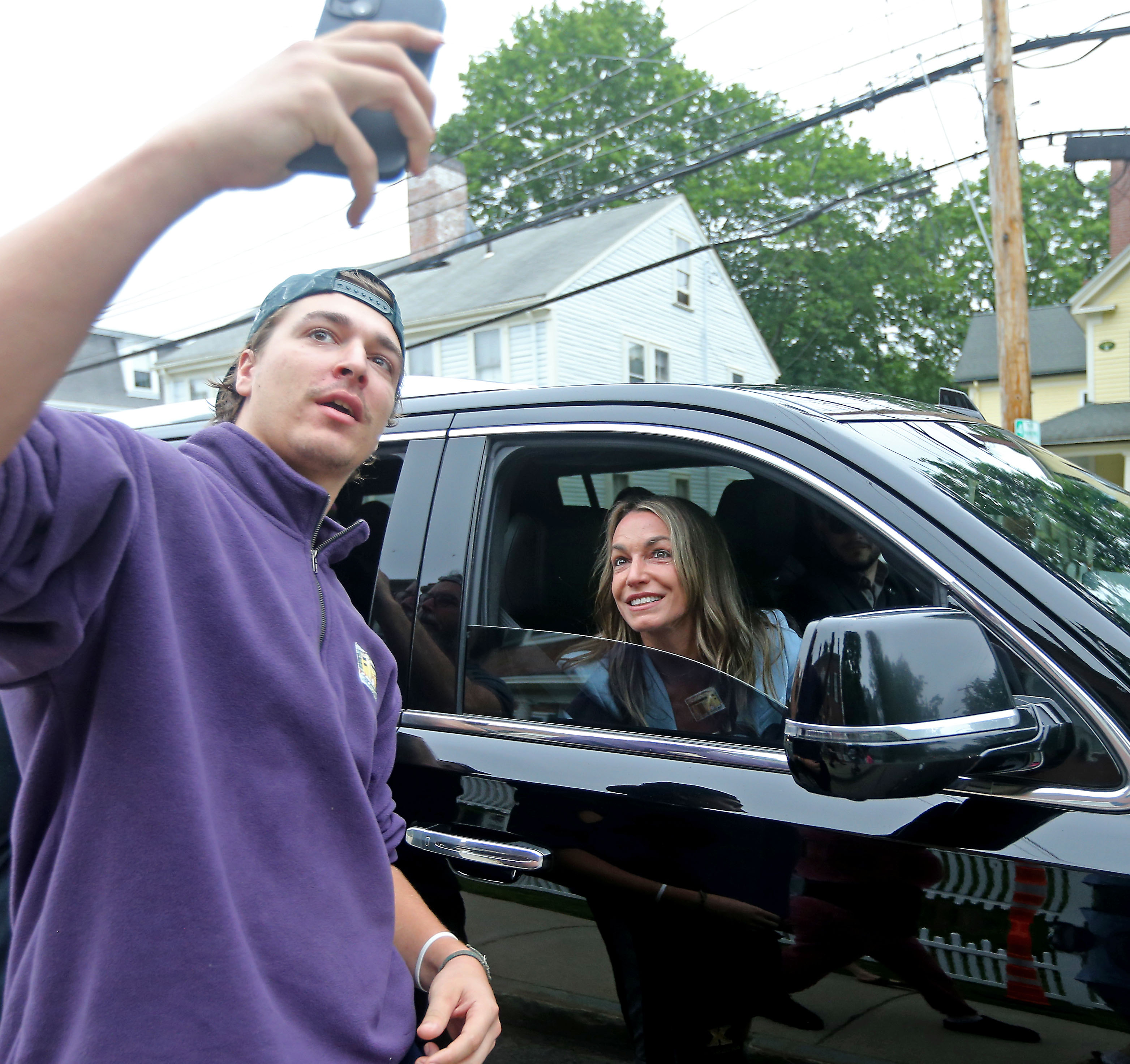 Karen Read greets her supporters and does selfies after she...