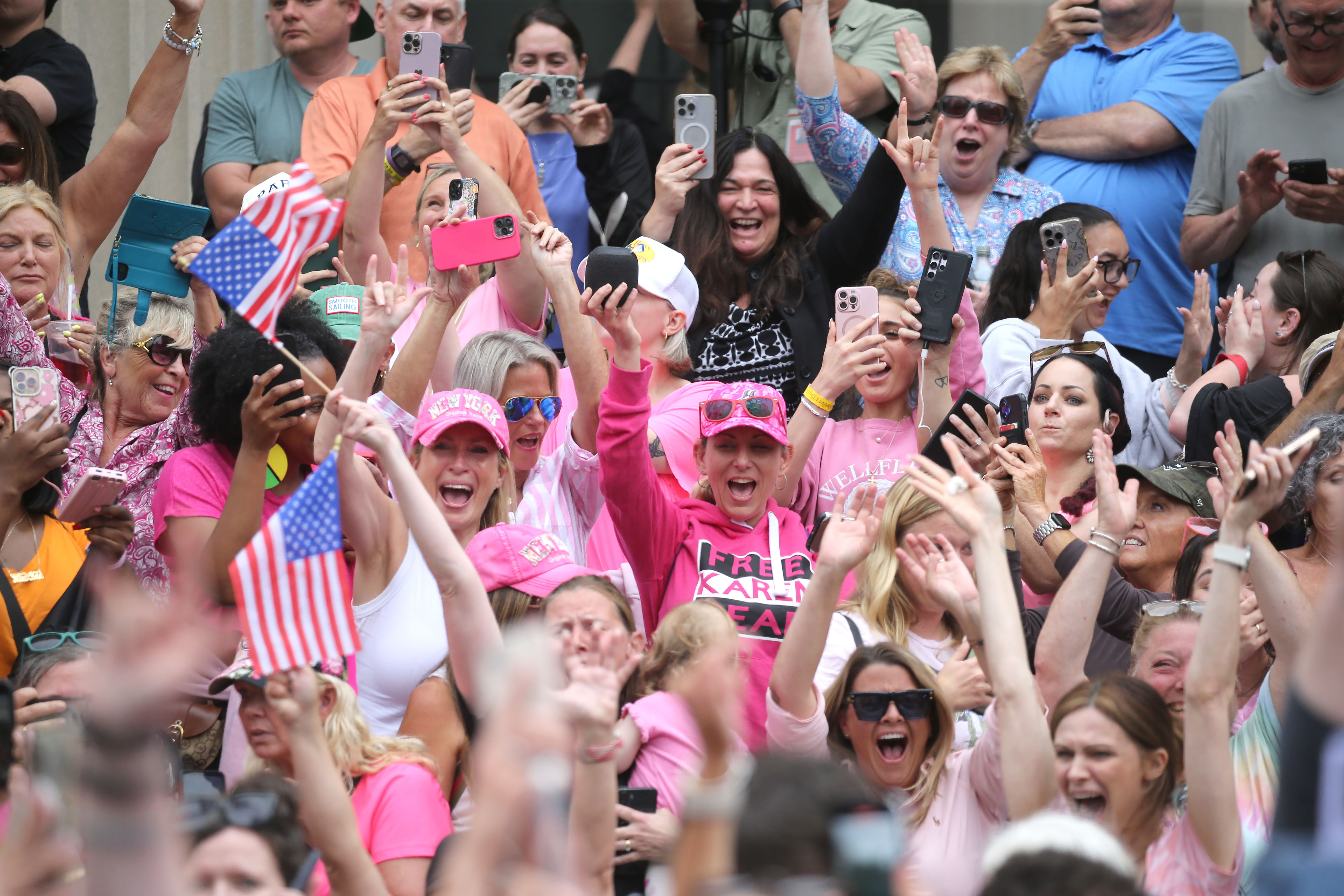 Supporters cheer as the verdicts are read as she is...