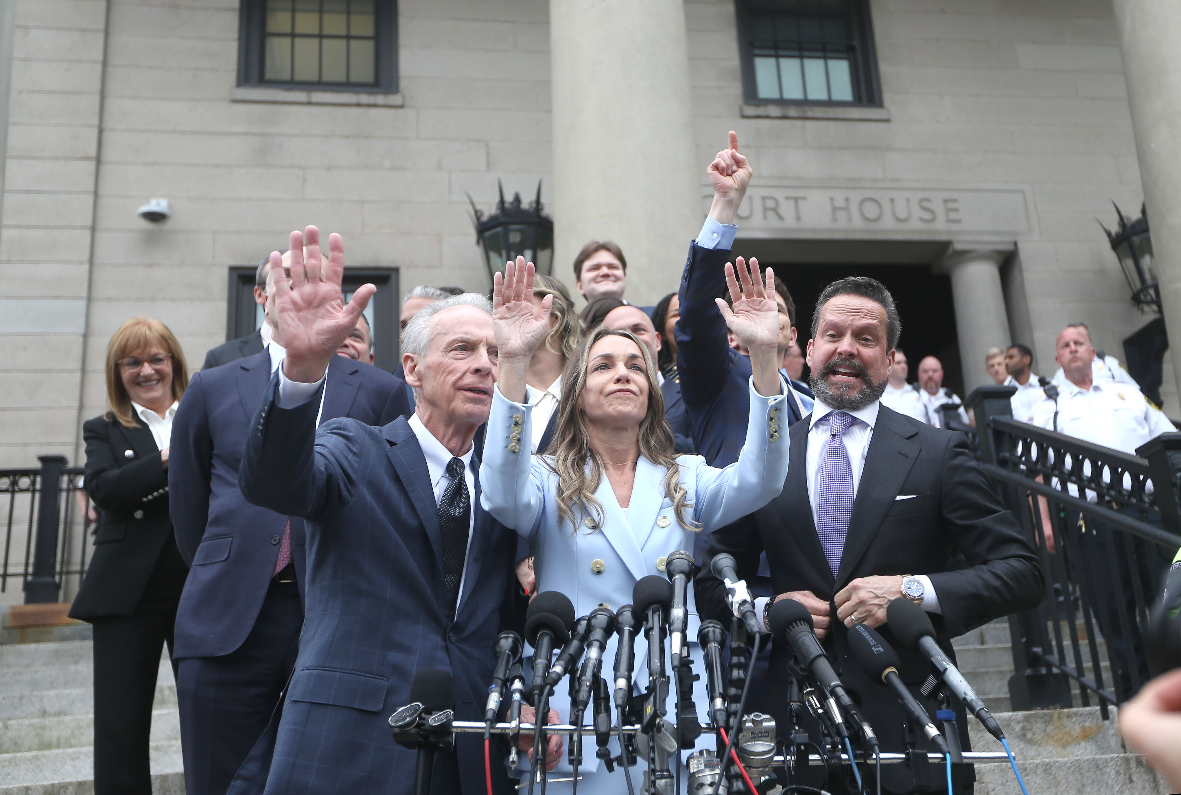 Karen Read greets her supporters after she is acquitted on...