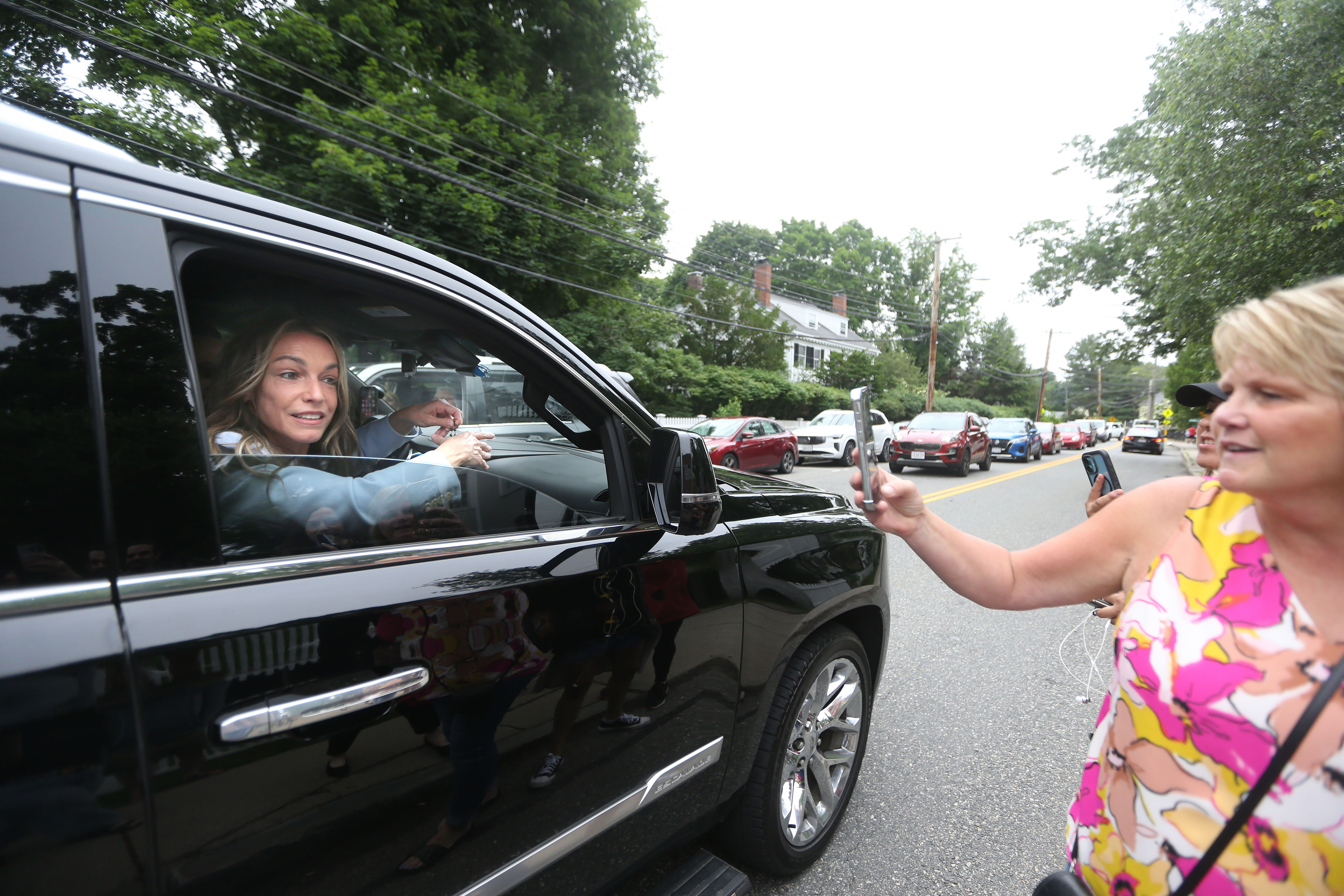 Karen Read greets her supporters and does selfies after she...