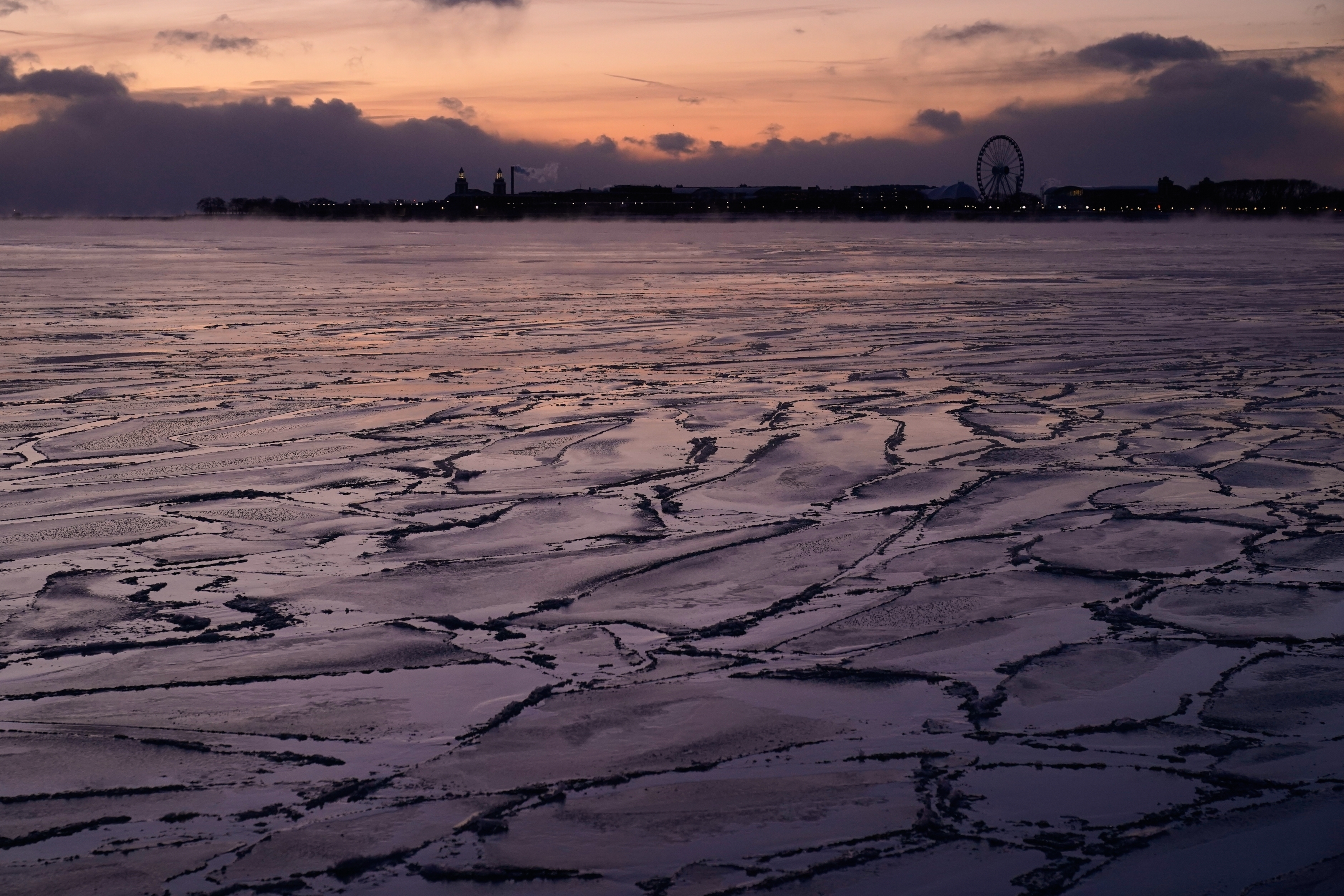 Ice forms along the shore of Lake Michigan, Friday, Jan....