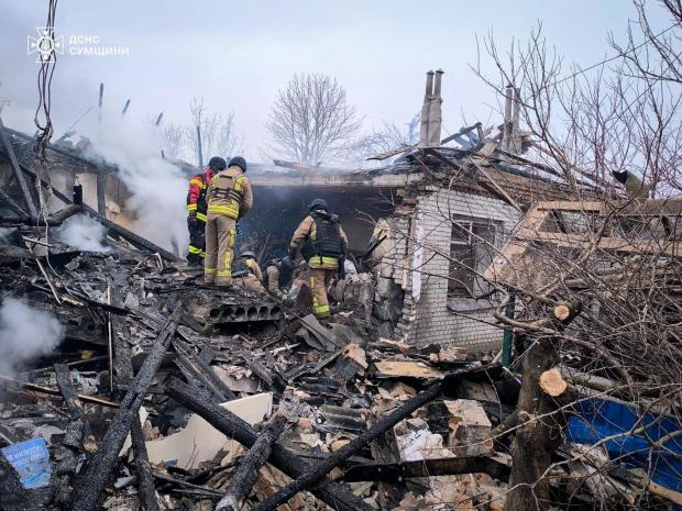 Firefighters put out a blaze in private houses following a Russian air attack in Sumy region, Ukraine.