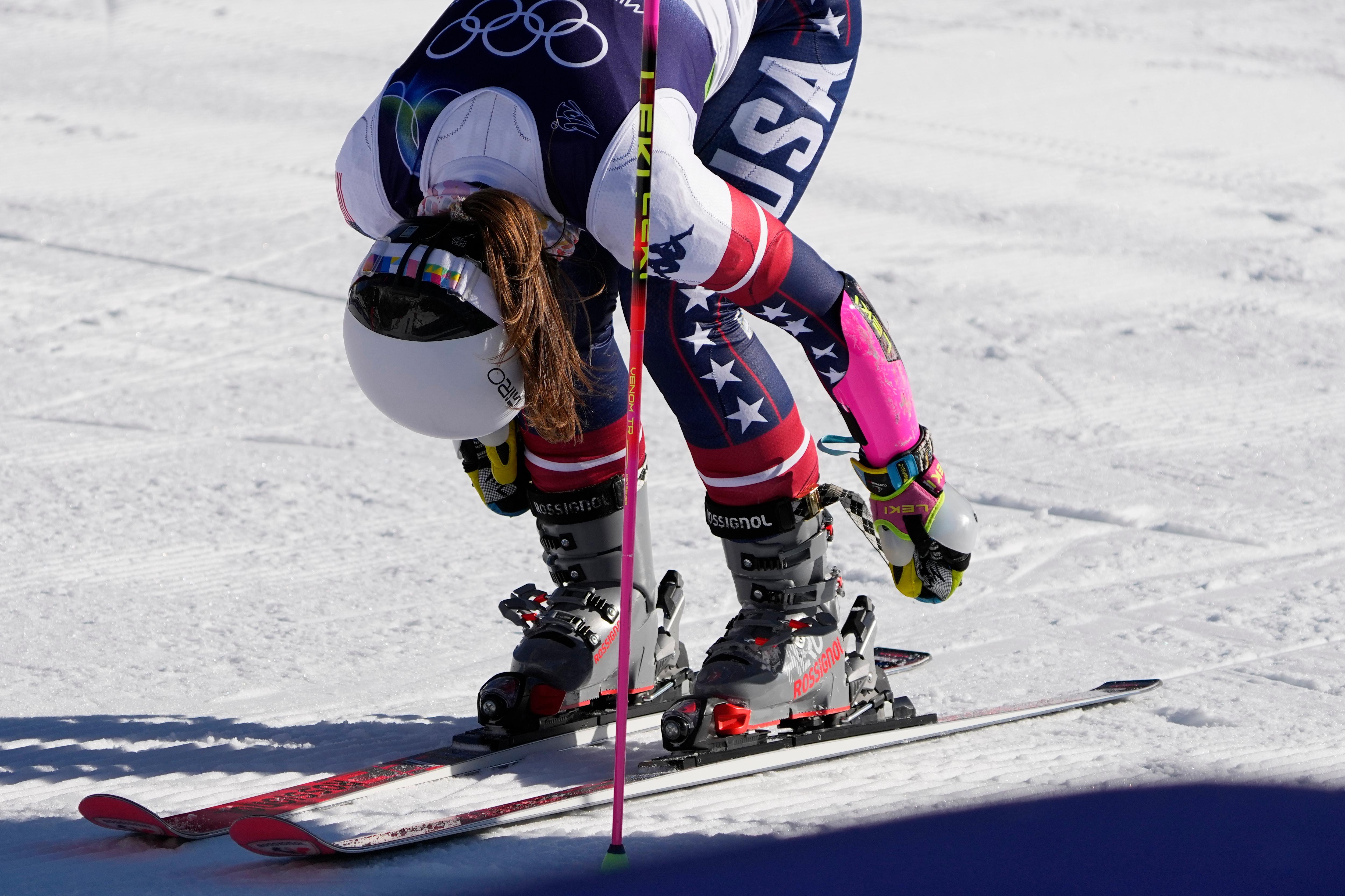 United States’ Paula Moltzan unlatches her boots at the finish...