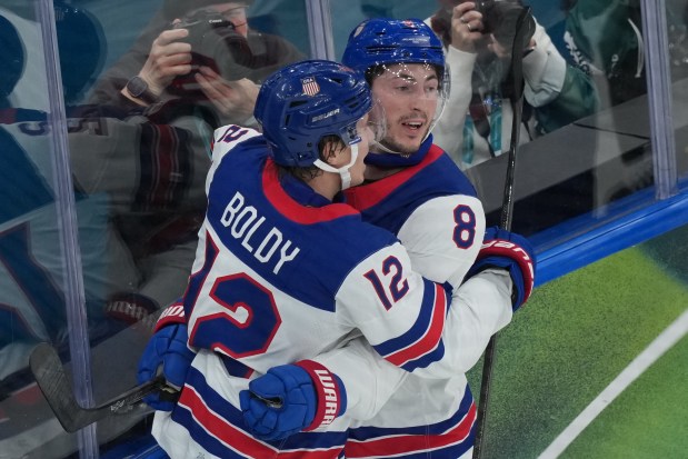 United States' Zach Werenski celebrates after scoring his side's opening goal during a preliminary round game of men's ice hockey between the United States and Germany at the 2026 Winter Olympics, in Milan, Italy, Sunday, Feb. 15, 2026. (AP Photo/Carolyn Kaster)