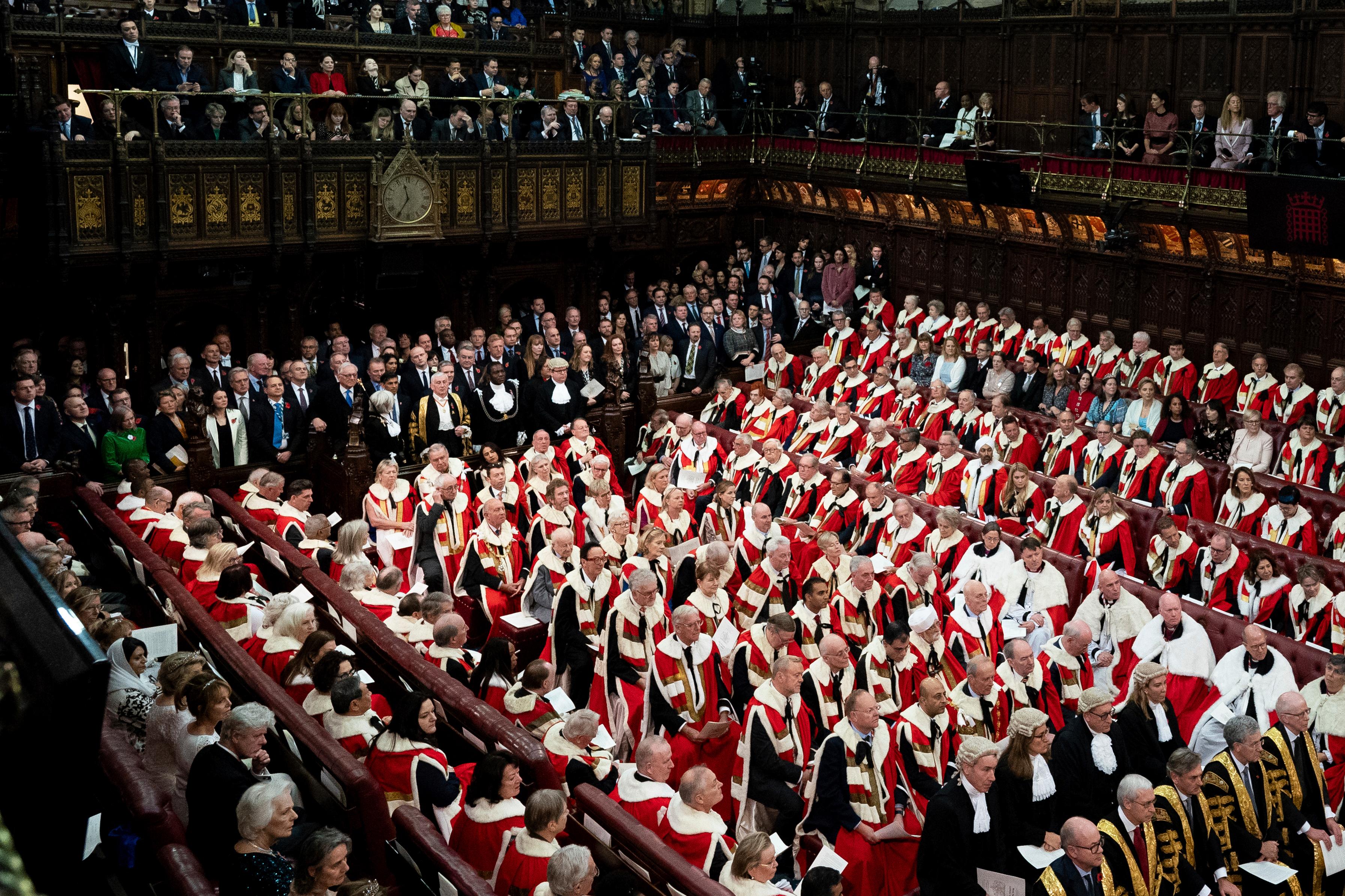 FILE – Members of the House of Commons and Lords...