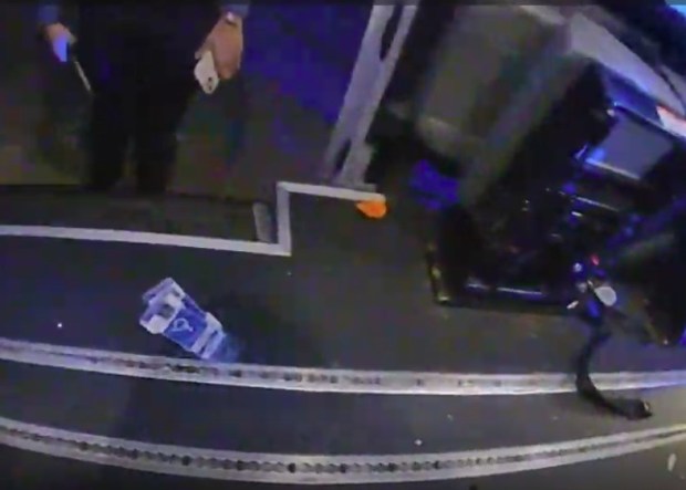 Handicapped placards inside the van at the Woburn crash scene. (MSP body camera video screengrab)