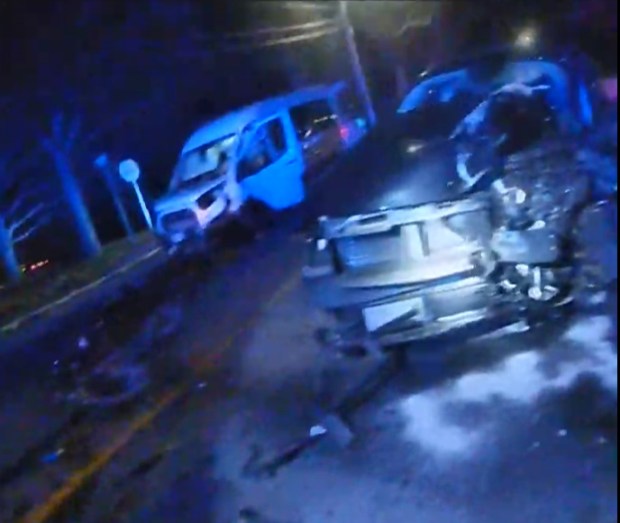 The smashed van and cruiser at the Woburn crash scene. (MSP body camera video screengrab)