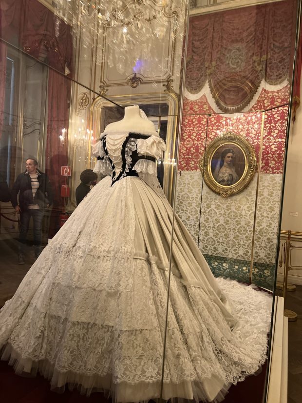 Ballgown owned by Empress Elisabeth (Sisi) of Austria. January 2026. The author, Marla Jo Fisher, at the Vienna Opera House. January 2026. (Photo by Marla Jo Fisher, Orange County Register/SCNG)
