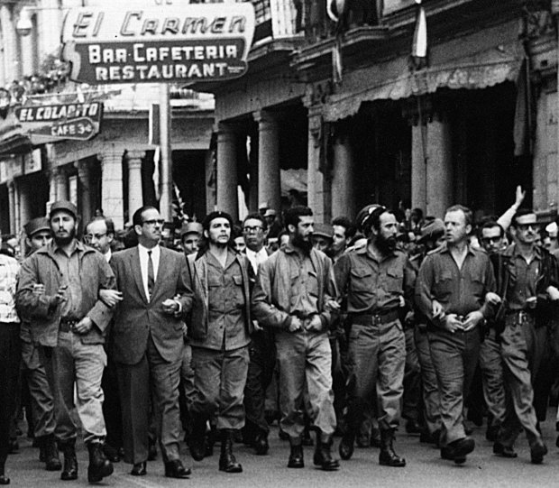 Cuban leaders walk arm-in-arm at the head of the March 5, 1960 funeral procession for the victims of the La Coubre explosion, blamed by the Cuban government on a U.S. bomb attack on the Cuban ship La Coubre in the harbor of Havana. From left to right are Fidel Castro; the first president of post-Batista Cuba, Osvaldo Dortico; Ernesto "Che" Guevara; Defense Minister Augusto Martinez-Sanchez; Ecology Minister Antonio Nunez-Jimenez; American William Morgan from Toledo, Ohio; and Spaniard Eloy Gutierrez Menoyo. Morgan became a Cuban sympathizer after a friend was reportedly killed by President Batista''s police. He was later executed in 1961, accused of being anti-Communist. Menoyo later founded the anti-Castro Alfa 66 organization. (AP Photo)