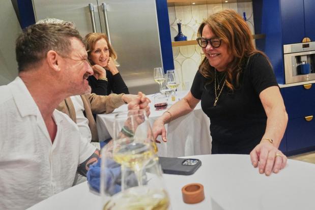 Rachael Ray talks to guests during a private dinner at the South Beach Wine and Food Festival.