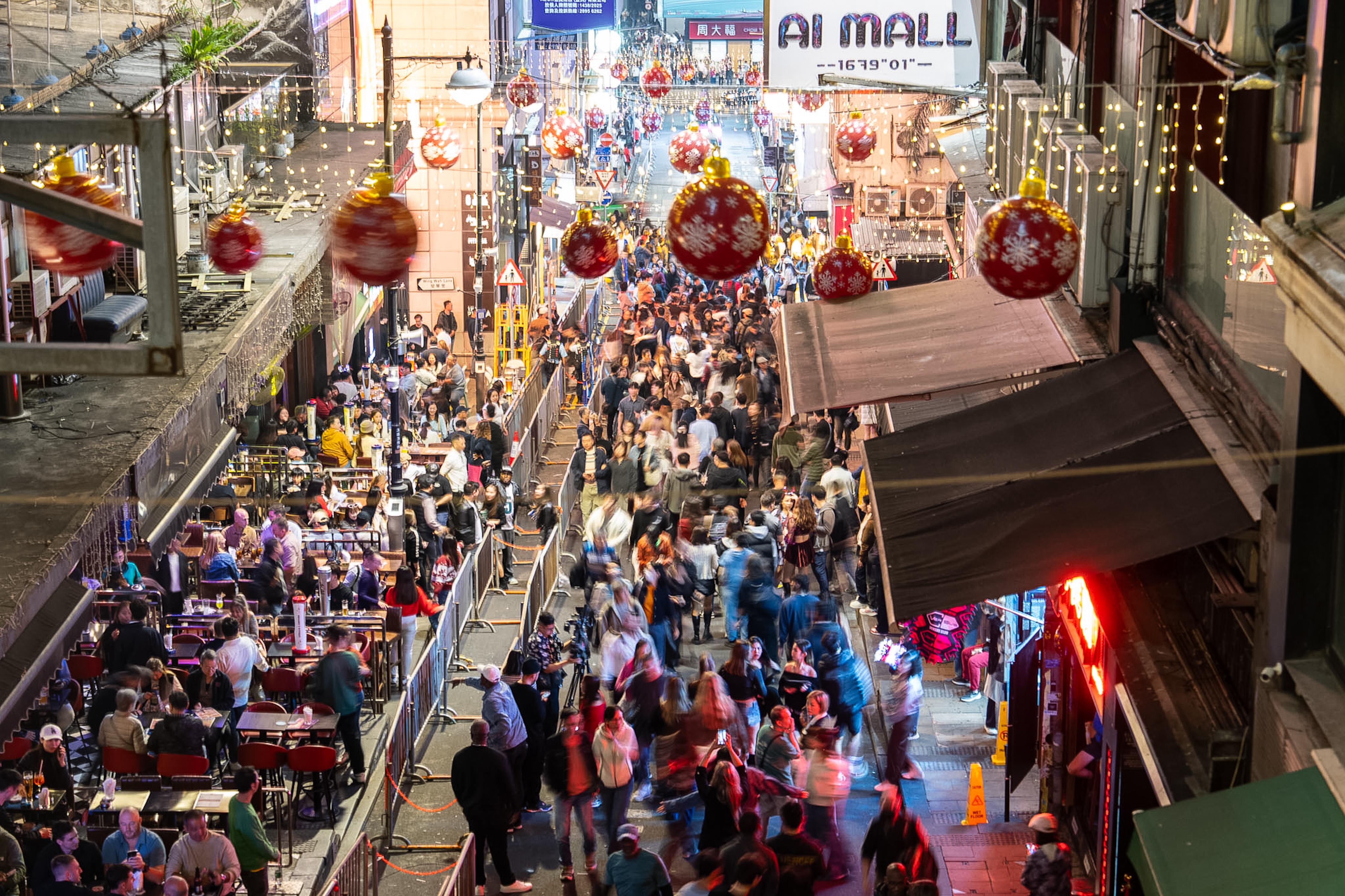 People gather at Lan Kwai Fong to celebrate the start...