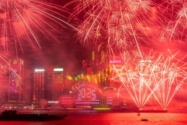 FILE - Fireworks explode over Victoria Harbour to celebrate the start of 2025 at Tsim Sha Tsui in Hong Kong, Jan. 1, 2025. (AP Photo/Chan Long Hei, File)