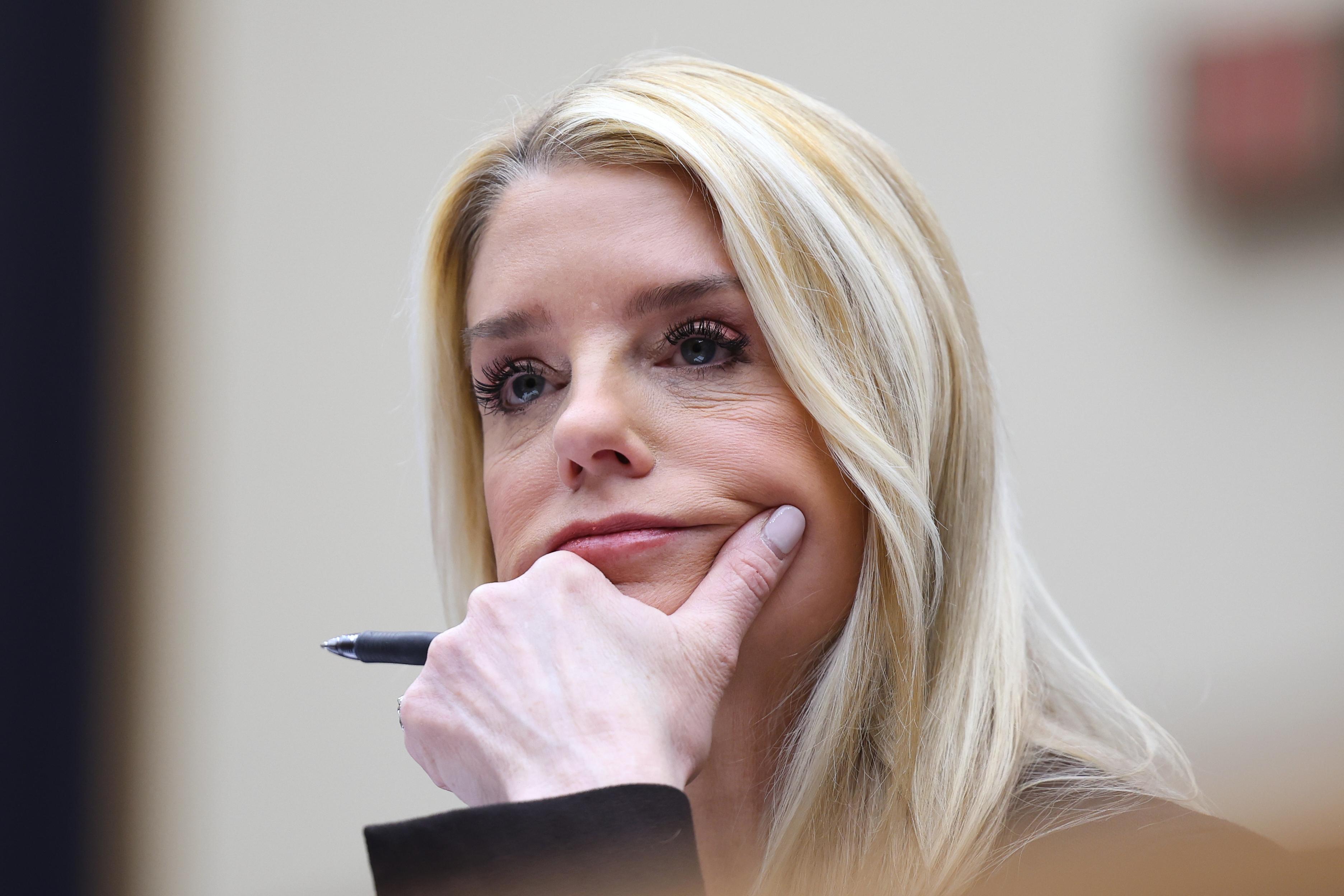 FILE – Attorney General Pam Bondi listens as she testifies...