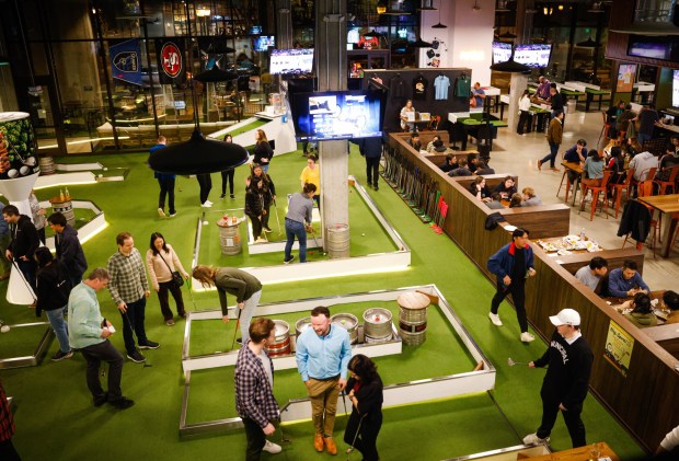People play trivia and indoor mini-golf at Tipsy Putt in Sunnyvale, Calif., on Tuesday, Feb. 6, 2024. (Shae Hammond/Bay Area News Group)