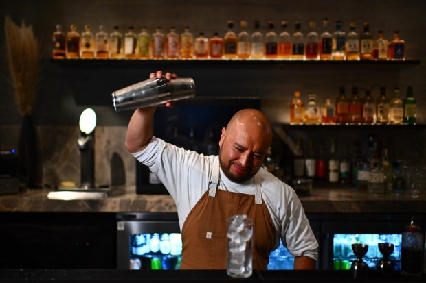 Bartender Alfredo Velazquez mixes up a drink called East Meets West at the Nokori Japanese Whisky Bar inside the Tetra Hotel in Sunnyvale, Calif., on Thursday, Oct. 31, 2024. The East Meets West has Legent bourbon with matcha honey, lemon, mint, and ginger ale. (Jose Carlos Fajardo/Bay Area News Group)
