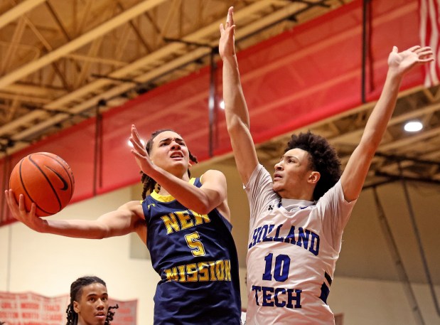 New Mission's Jaden Hays tries to score against Holland Tech's Elijah Flores during the first half. (Photo By Matt Stone/Boston Herald)