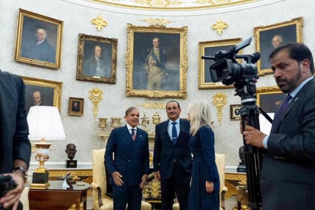 Pakistan Prime Minister Muhammad Shehbaz Sharif, left, and Gen. Syed Asim Munir wait for their meeting with President Donald Trump, in the Oval Office at the White House, Thursday, Sept. 25, 2025, in Washington. (AP Photo/Alex Brandon)